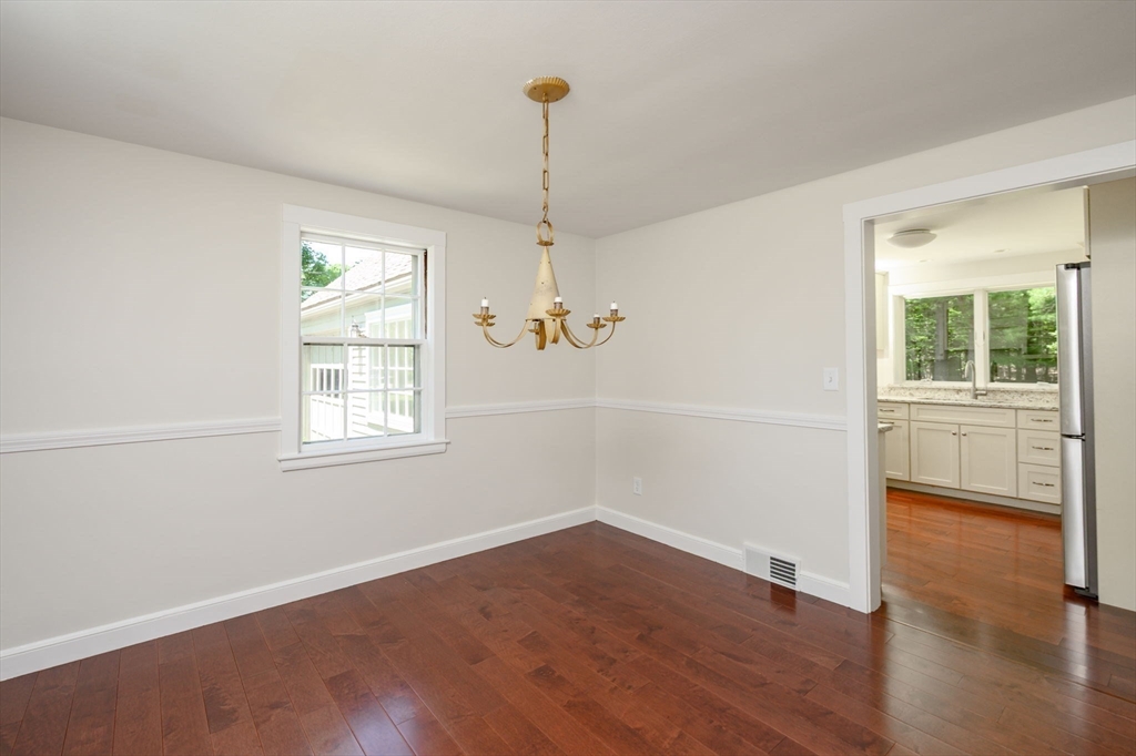 30 Huntley Road Hingham, MA 02043 - Photo 11 of 28 an empty room with wooden floor and windows