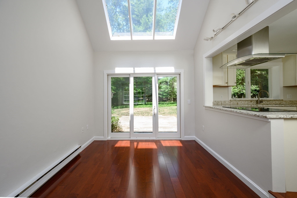 30 Huntley Road Hingham, MA 02043 - Photo 4 of 28 a view of an empty room with wooden floor and a window