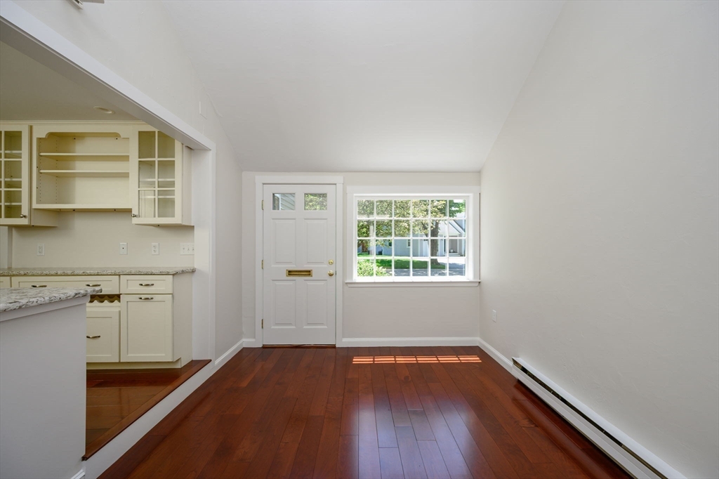 30 Huntley Road Hingham, MA 02043 - Photo 5 of 28 an empty room with wooden floor and windows