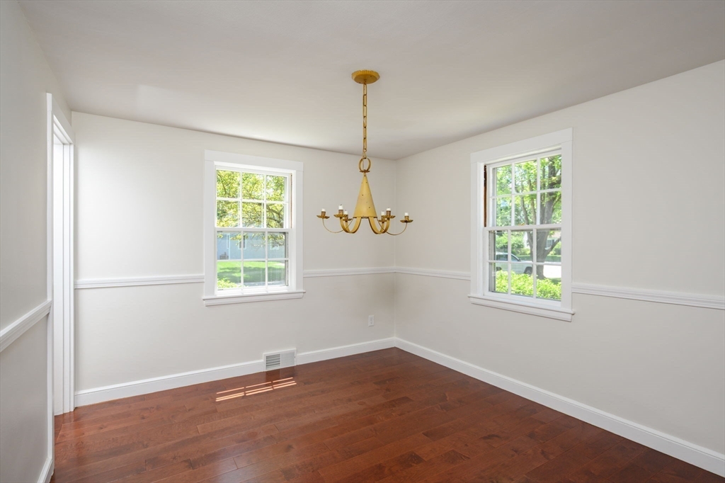 30 Huntley Road Hingham, MA 02043 - Photo 10 of 28 an empty room with windows and a chandelier fan