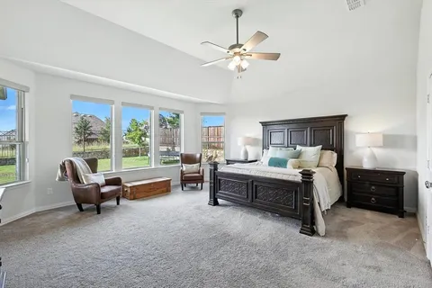 a bed room with furniture and a window