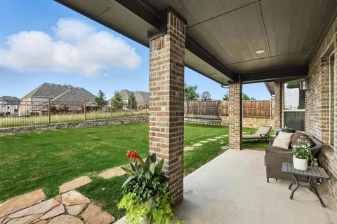 a view of a patio with chair and table