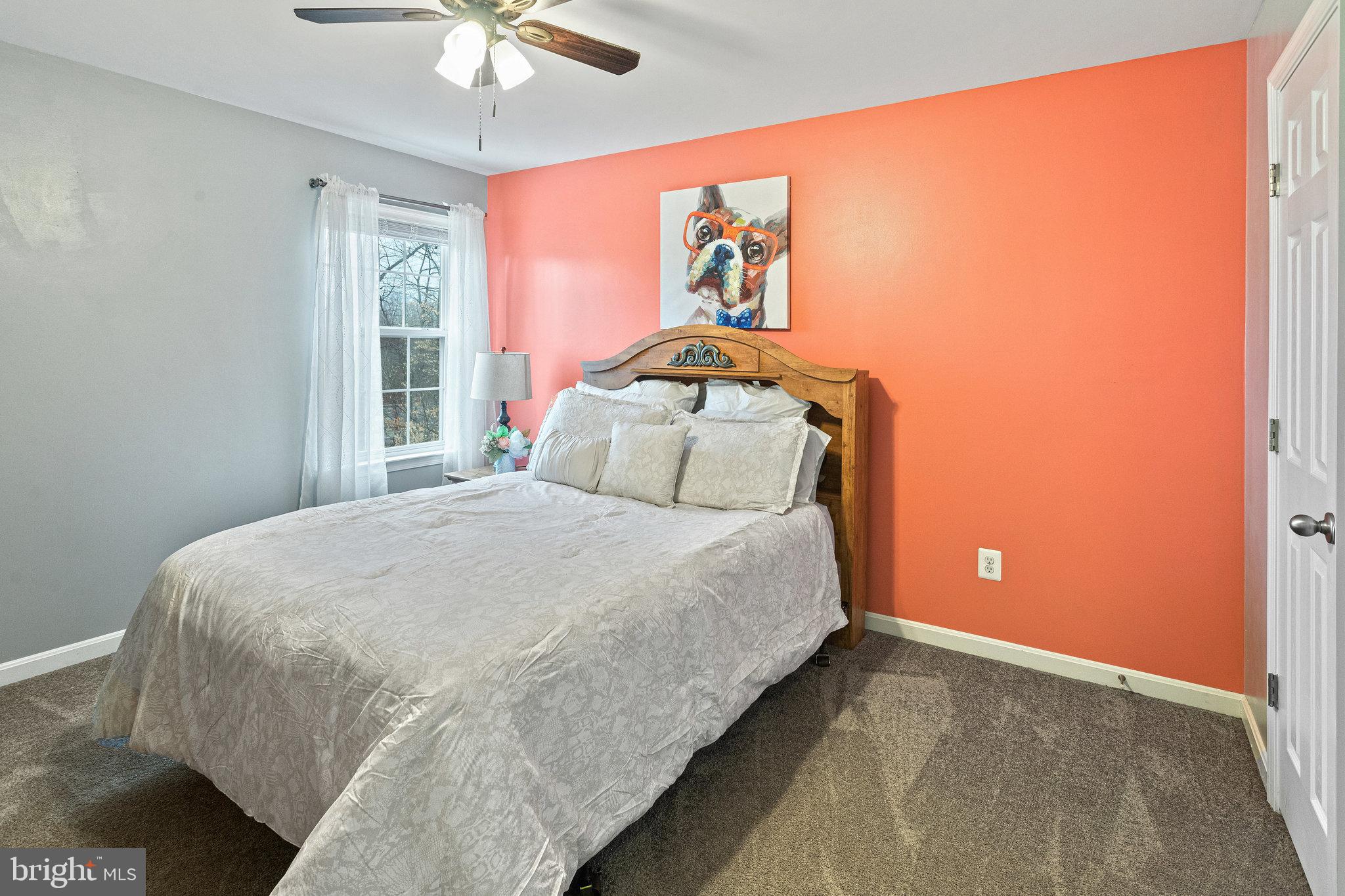 3445 Eagle Ridge Drive Woodbridge, VA 22191 - Photo 22 of 39 a bedroom with a bed and a chandelier