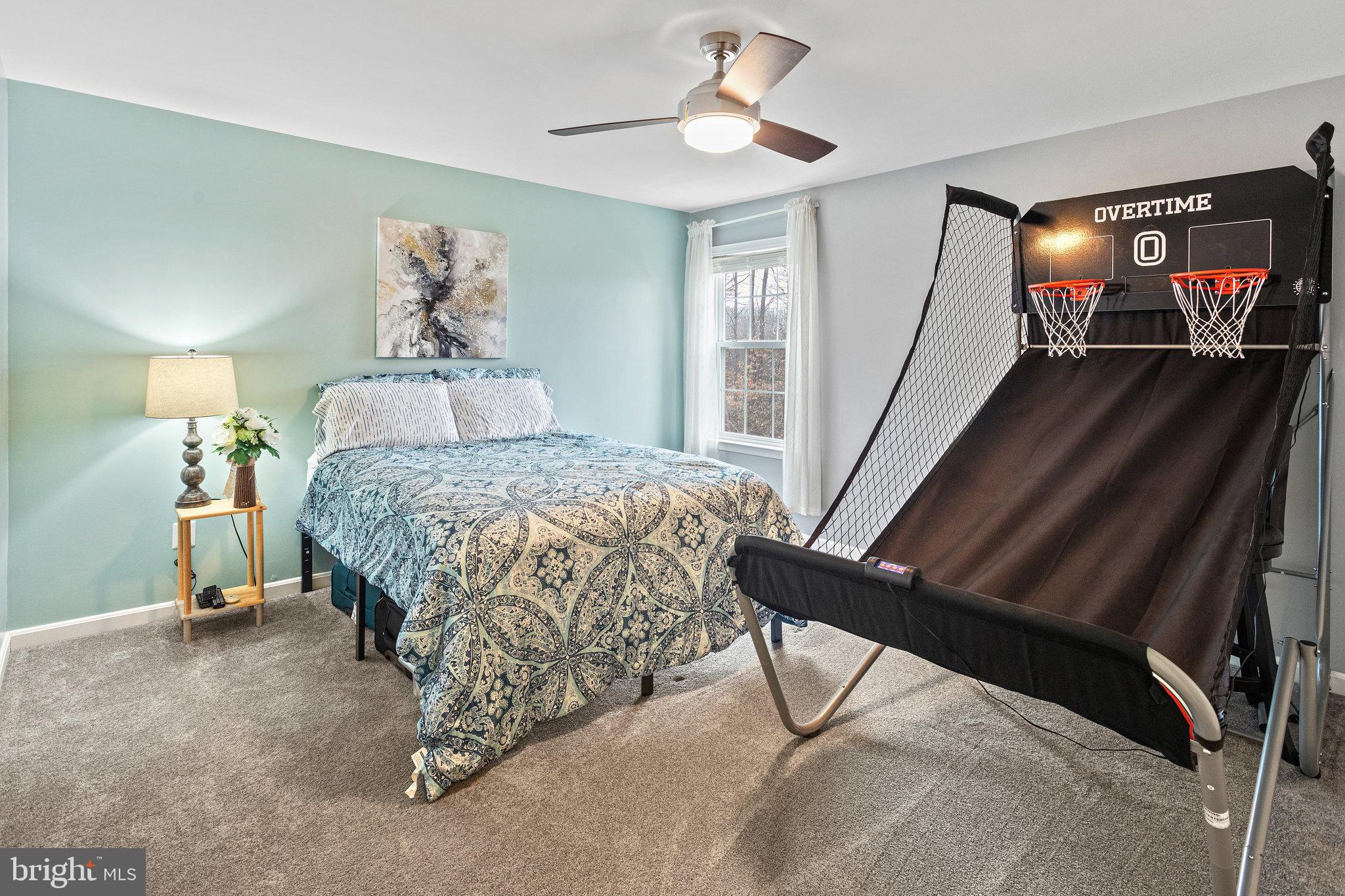 3445 Eagle Ridge Drive Woodbridge, VA 22191 - Photo 24 of 39 a bedroom with a bed and a mirror on the dresser