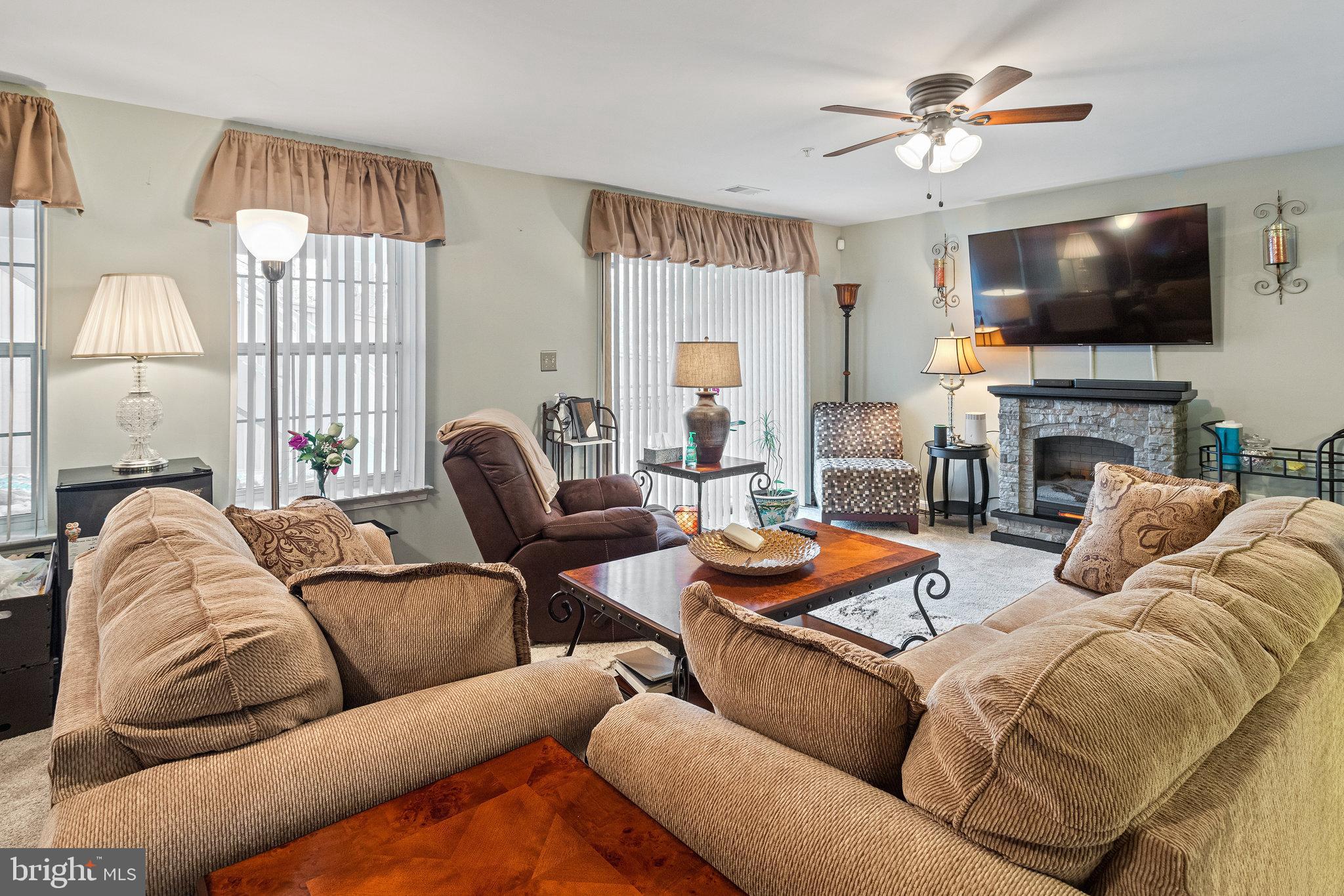 3445 Eagle Ridge Drive Woodbridge, VA 22191 - Photo 29 of 39 a living room with furniture fireplace and a flat screen tv