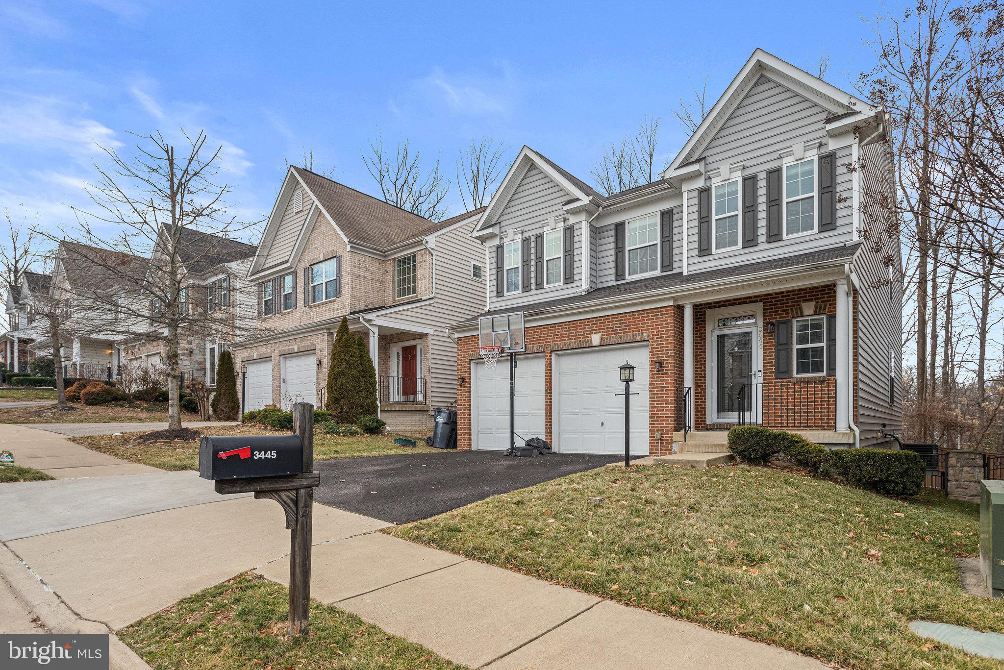 3445 Eagle Ridge Drive Woodbridge, VA 22191 - Photo 3 of 39 a front view of a house with a yard