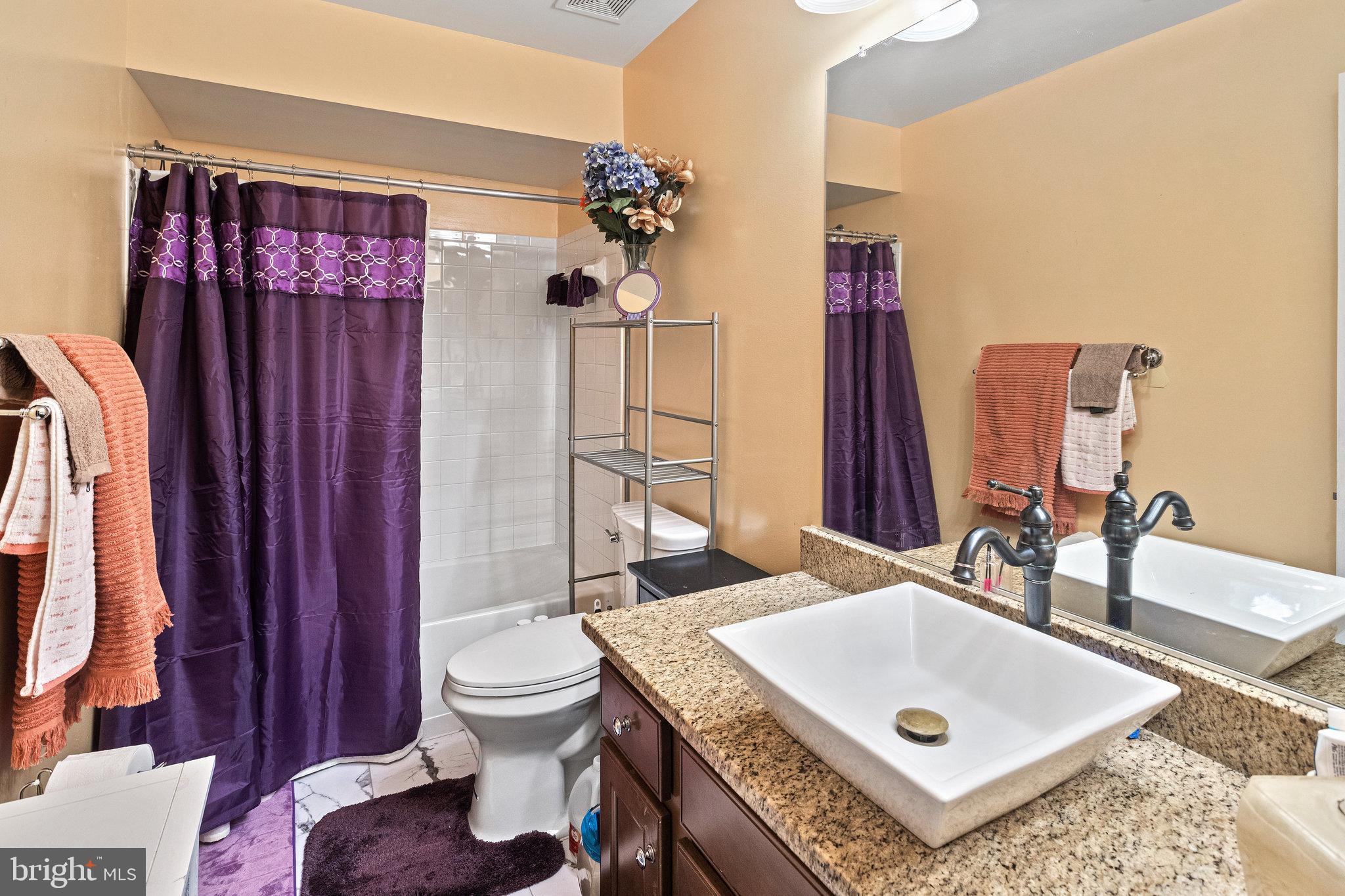 3445 Eagle Ridge Drive Woodbridge, VA 22191 - Photo 32 of 39 a bath room with a toilet a sink and a mirror