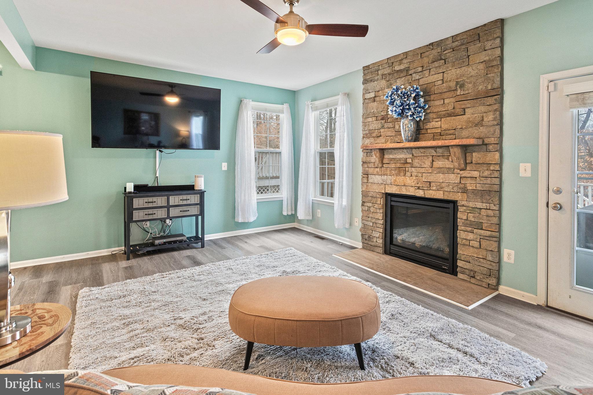 3445 Eagle Ridge Drive Woodbridge, VA 22191 - Photo 10 of 39 a living room with furniture and a fireplace