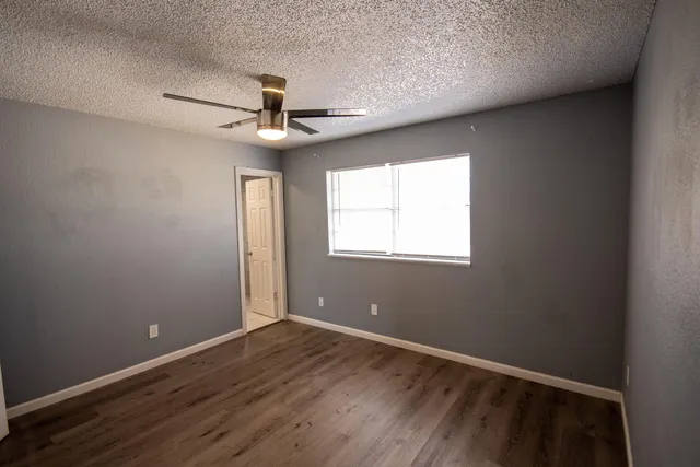 a bathroom with a sink mirror and toilet