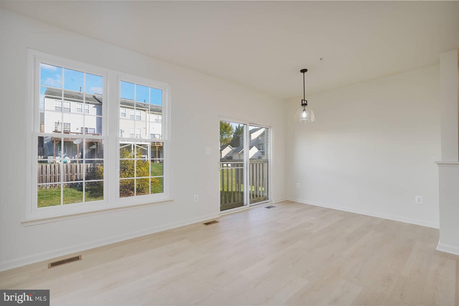 3506 Connor Place Frederick, MD 21704 - Photo 12 of 34 an empty room with windows and entrance