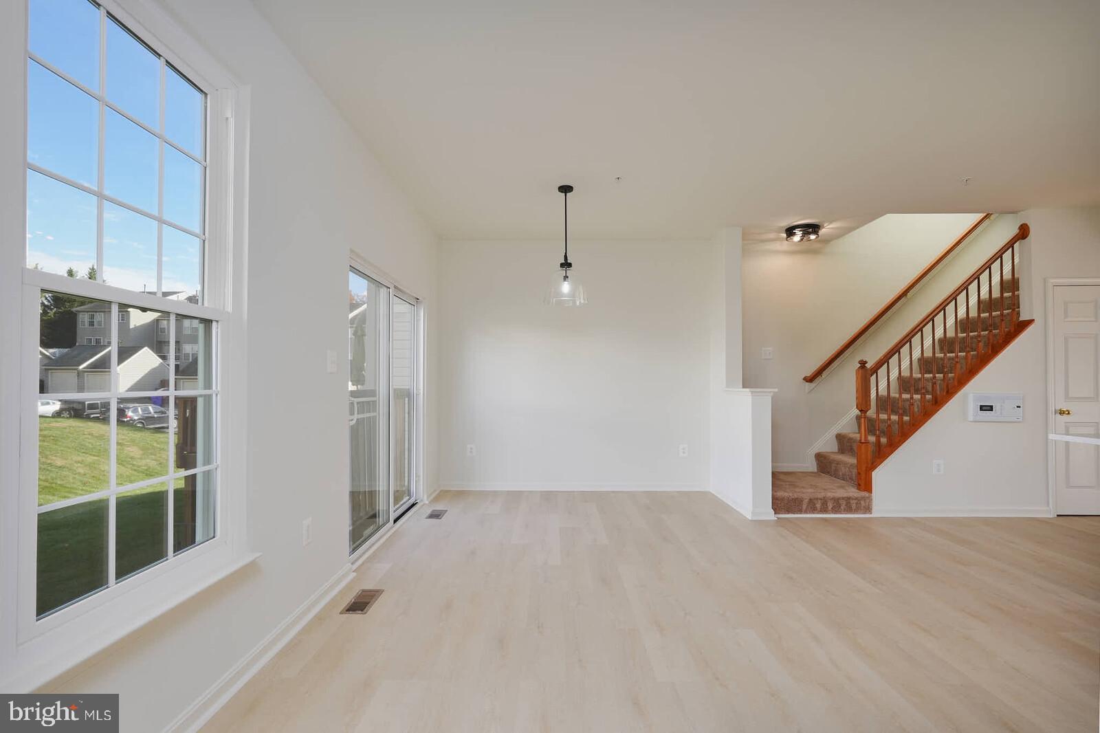 3506 Connor Place Frederick, MD 21704 - Photo 13 of 34 a view of an entryway with wooden floor and windows