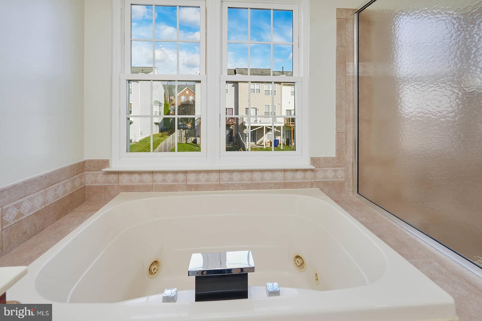 3506 Connor Place Frederick, MD 21704 - Photo 19 of 34 a bathroom with a tub and a window
