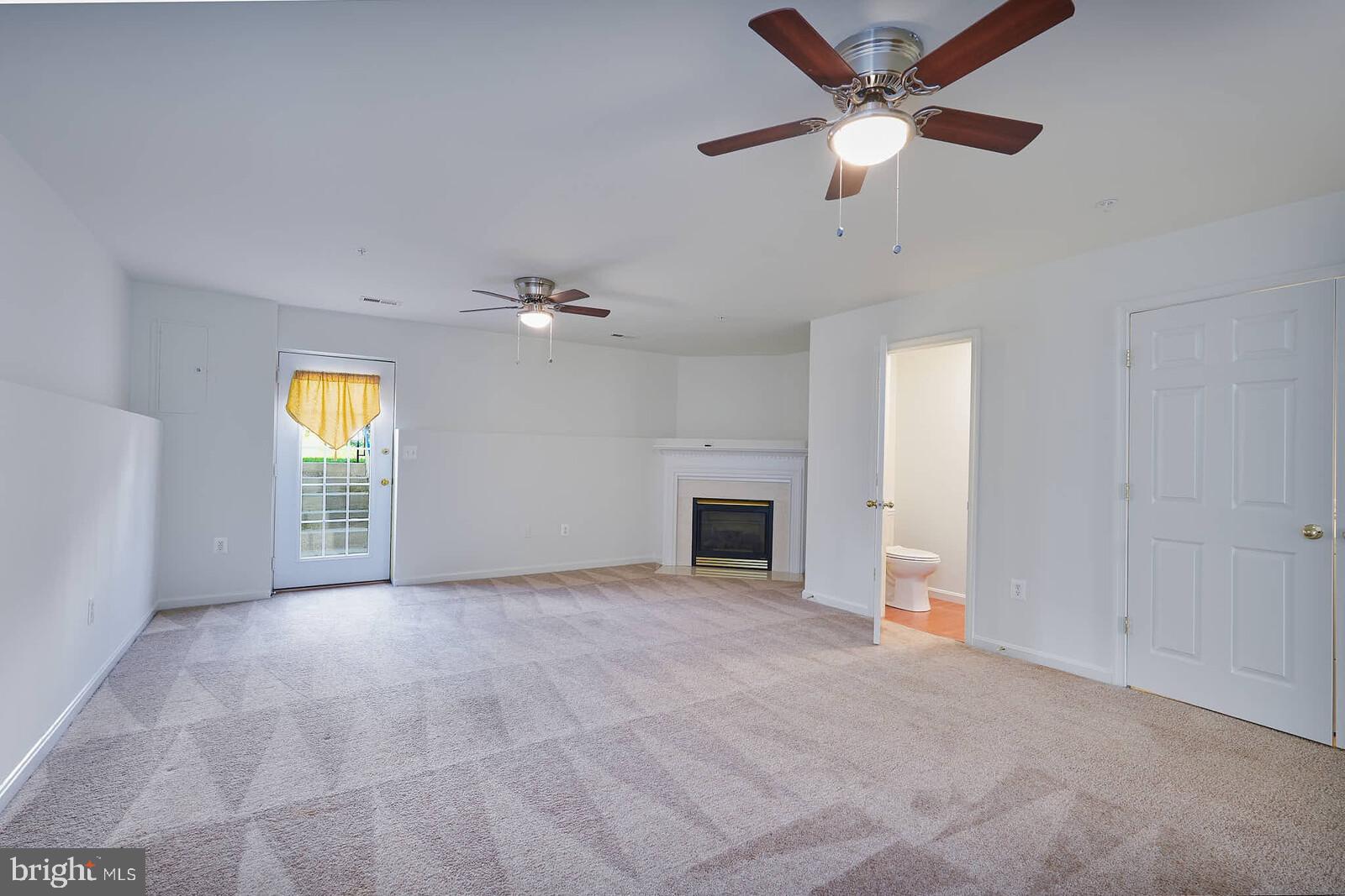 3506 Connor Place Frederick, MD 21704 - Photo 28 of 34 an empty room with windows and fireplace