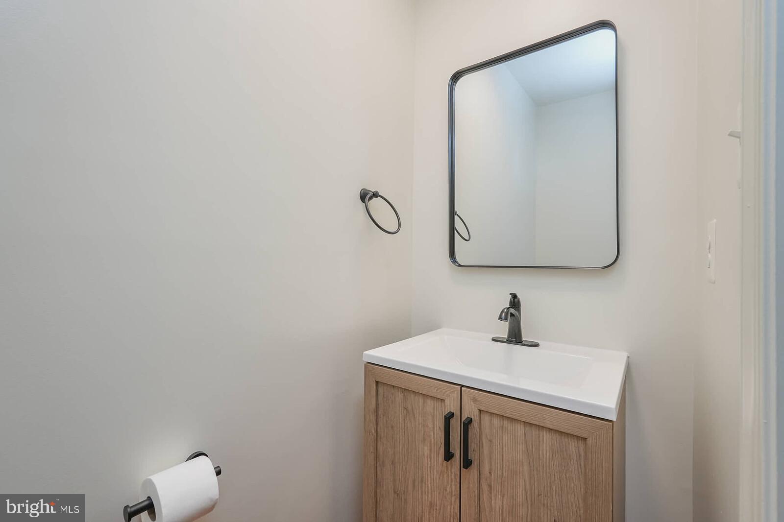 3506 Connor Place Frederick, MD 21704 - Photo 29 of 34 a bathroom with a sink and a mirror