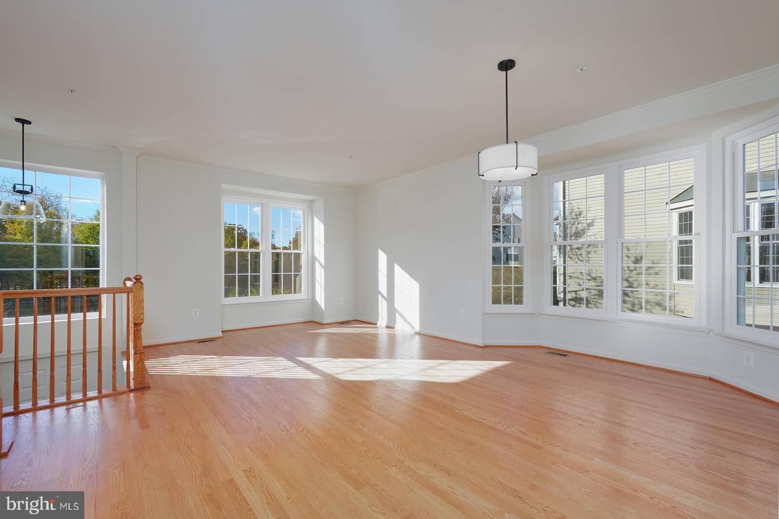 3506 Connor Place Frederick, MD 21704 - Photo 4 of 34 a view of empty room with wooden floor and fan