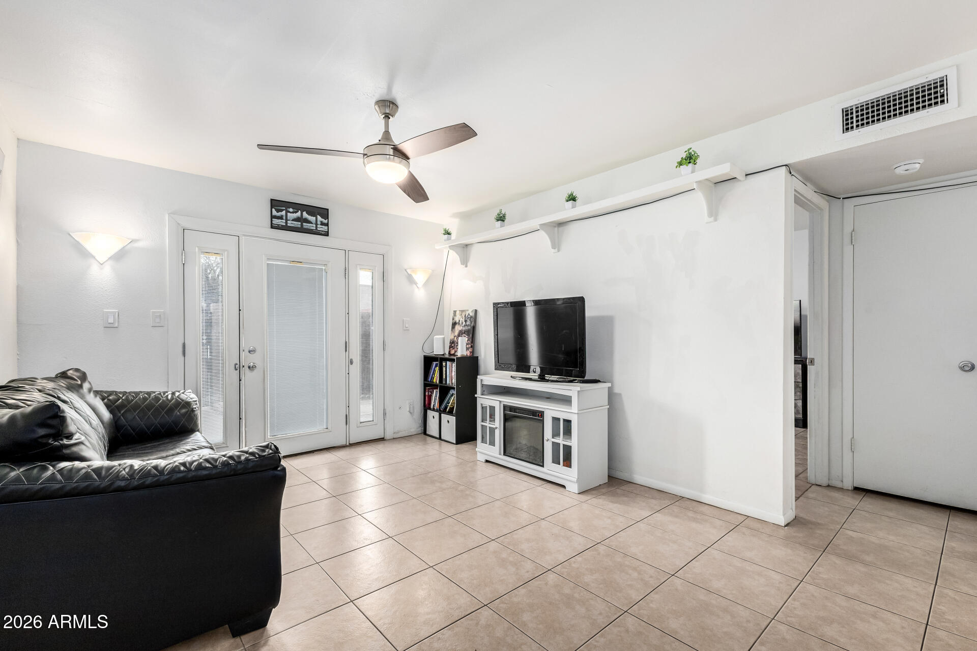 600 South Dobson Road, Unit 122 Mesa, AZ 85202 - Photo 6 of 28 a living room with furniture and a flat screen tv