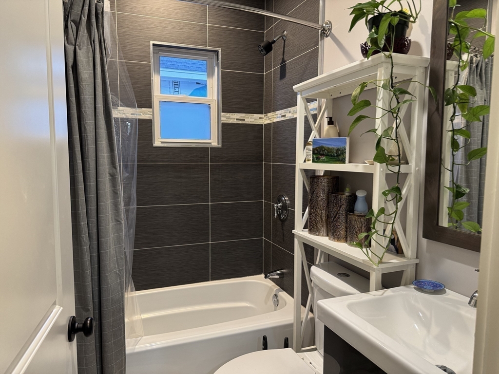 19 Macarthur Street, Unit 2 Somerville, MA 02145 - Photo 13 of 18 a bathroom with a bathtub and shower