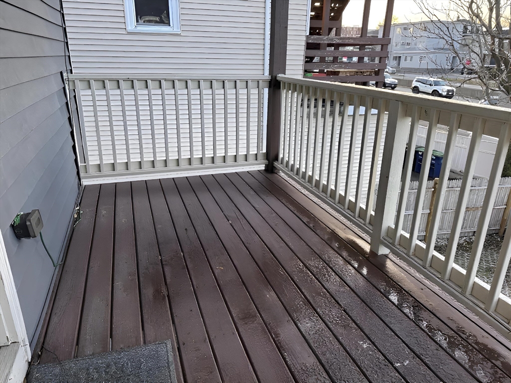 19 Macarthur Street, Unit 2 Somerville, MA 02145 - Photo 15 of 18 a view of a balcony with wooden floor