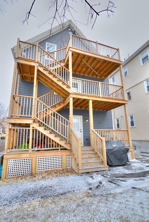 19 Macarthur Street, Unit 2 Somerville, MA 02145 - Photo 18 of 18 a view of a house with a deck