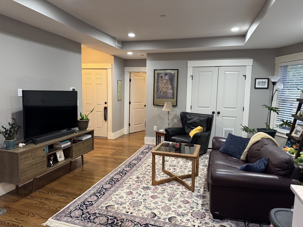 19 Macarthur Street, Unit 2 Somerville, MA 02145 - Photo 3 of 18 a living room with furniture and a flat screen tv