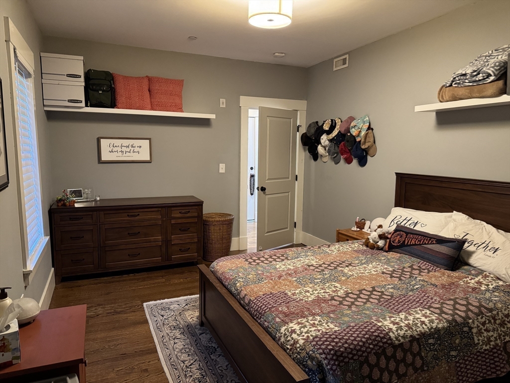 19 Macarthur Street, Unit 2 Somerville, MA 02145 - Photo 6 of 18 a bedroom with a bed and cabinets