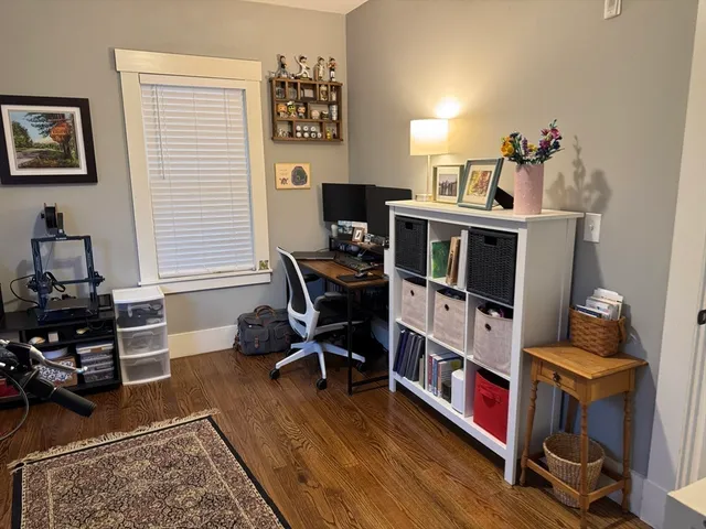 a room with furniture and wooden floor