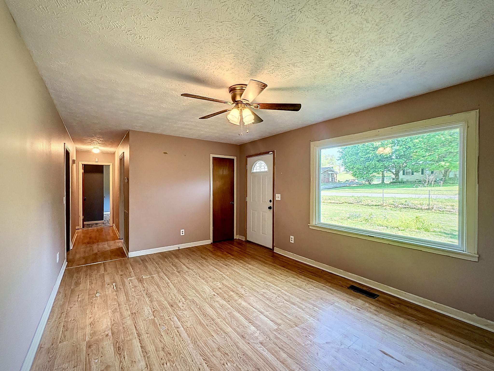 101 Haley Road Dickson, TN 37055 - Photo 5 of 17 an empty room with wooden floor and windows