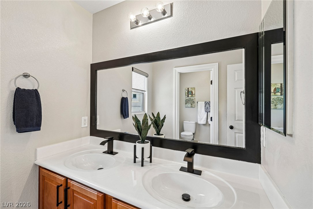1176 Butternut Ranch Court Henderson, NV 89052 - Photo 29 of 60 Double vanity with contemporary fixtures and ample counter space for daily routines.