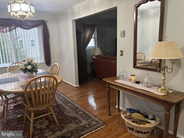 a bedroom with a bed and a flat tv screen on dresser