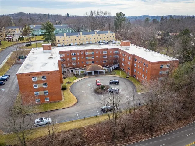 an aerial view of a house with a garden