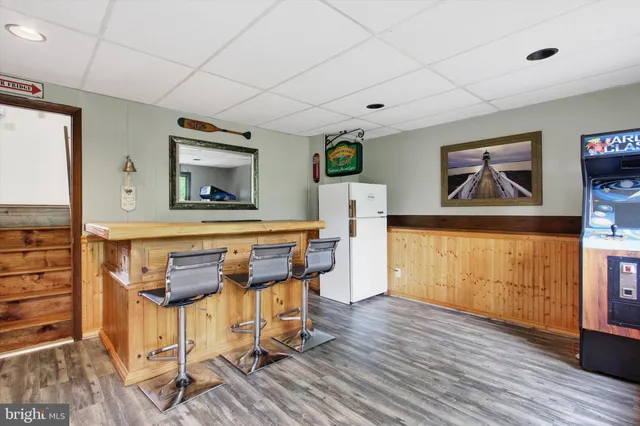 a view of a room with furniture and wooden floor