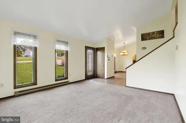 a view of an empty room with glass door