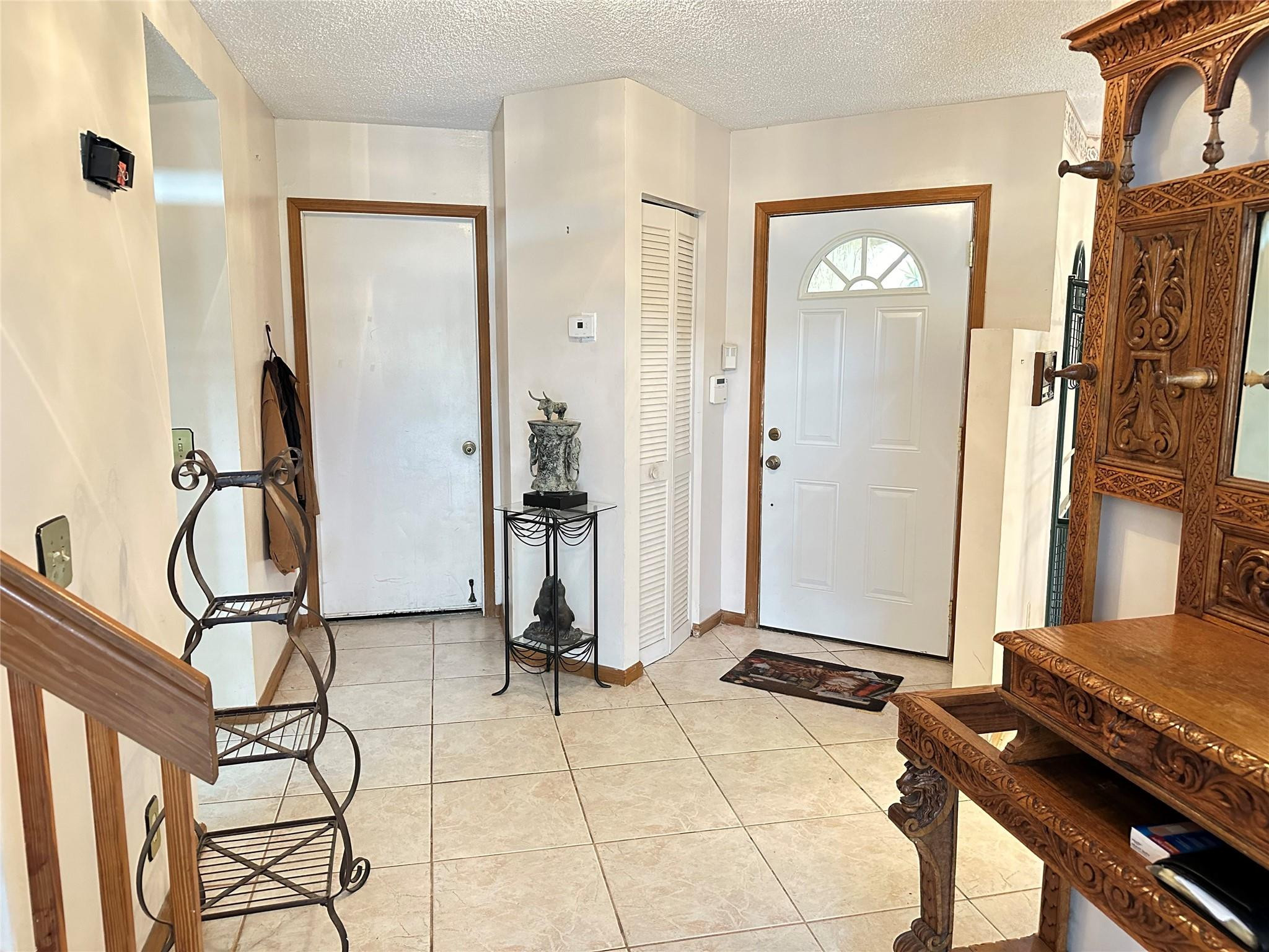 23205 Fountain View Drive, Unit D Boca Raton, FL 33433 - Photo 7 of 51 Foyer and Garage Door
