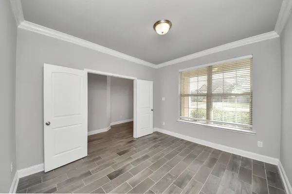 a view of a big room with a ceiling fan