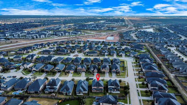 a view of a patio with couches chairs and a yard