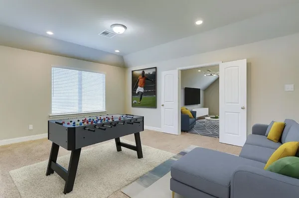 a view of empty room with ceiling fan