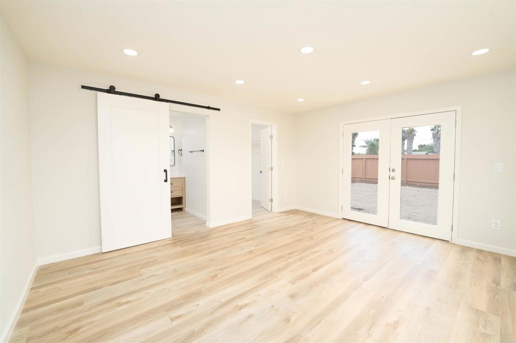 1314 Bluegrass Road Vista, CA 92083 - Photo 9 of 16 a view of an empty room with wooden floor