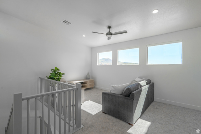 2972 West 570 North Hurricane, UT 84737 - Photo 64 of 104 Living area with an upstairs landing, light colored carpet, ceiling fan, and recessed lighting