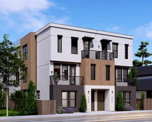 a front view of a building with a yard