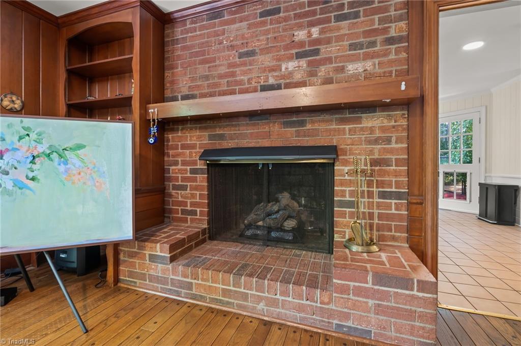 2786 Robinhood Road Winston-Salem, NC 27106 - Photo 6 of 26 Gas burning fireplace in den