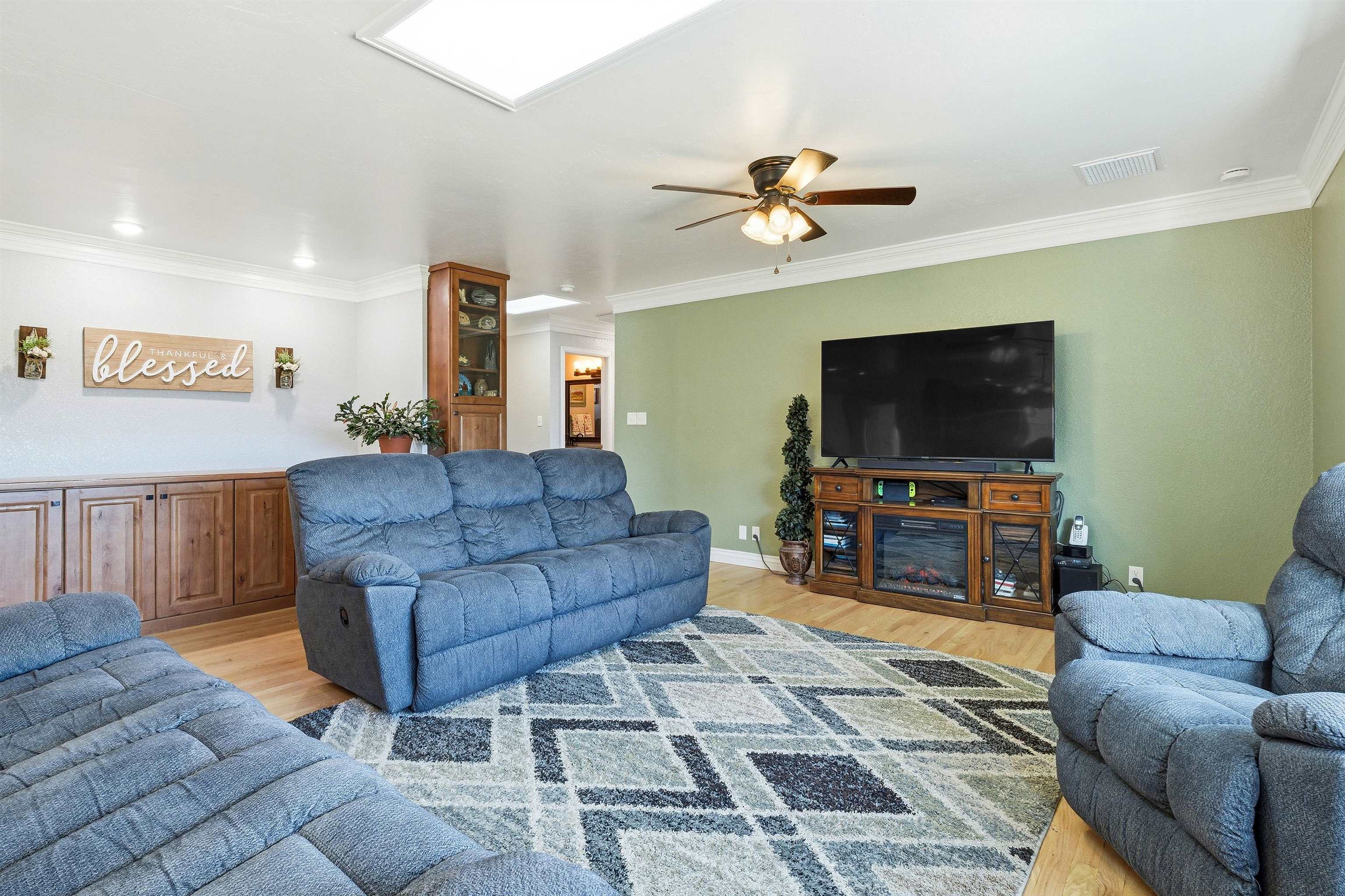 176-29 1/2 A 1/2 Road Grand Junction, CO 81503 - Photo 11 of 41 a living room with furniture and a flat screen tv