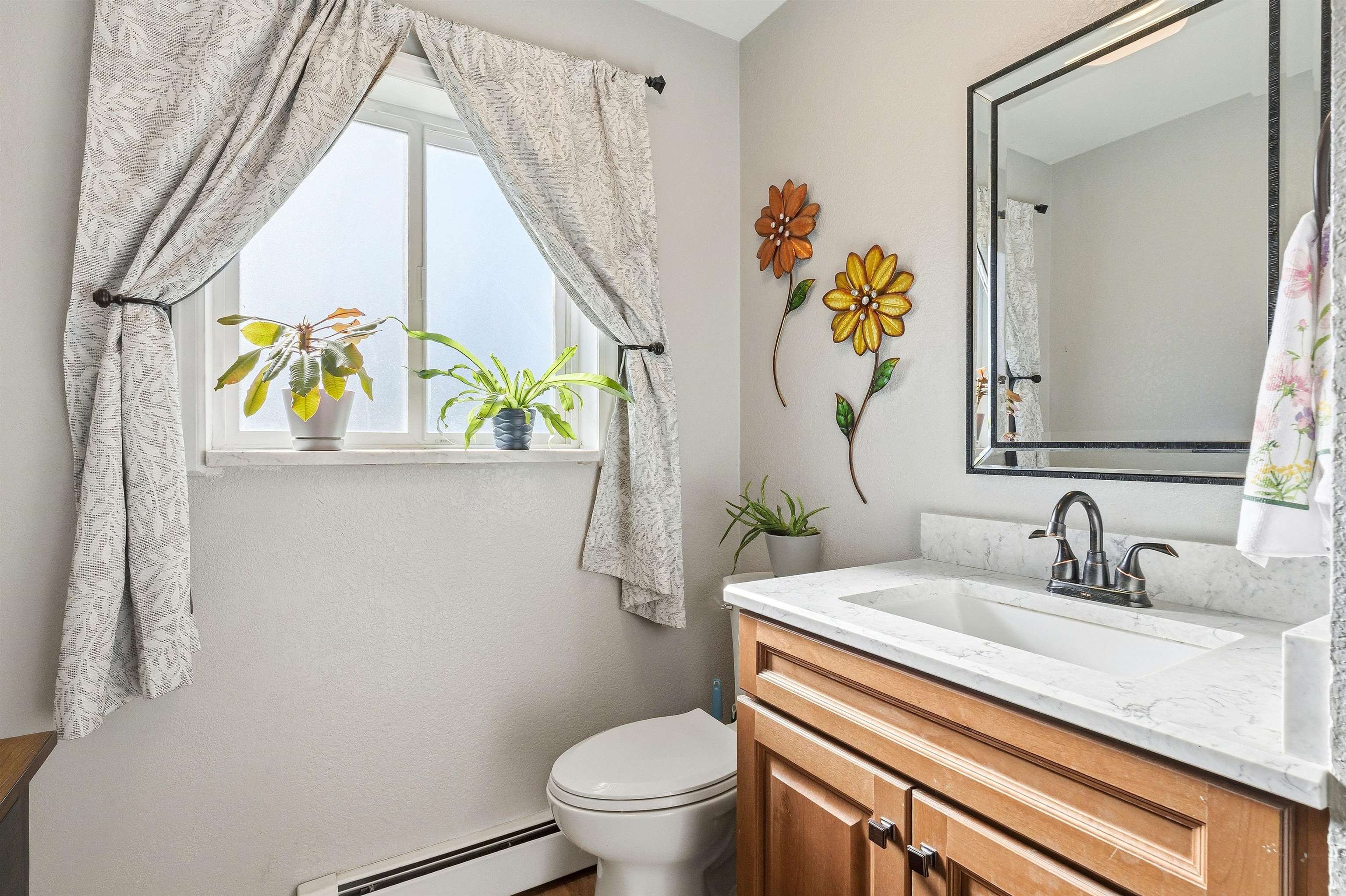 176-29 1/2 A 1/2 Road Grand Junction, CO 81503 - Photo 13 of 41 a bathroom with a sink a toilet and a mirror