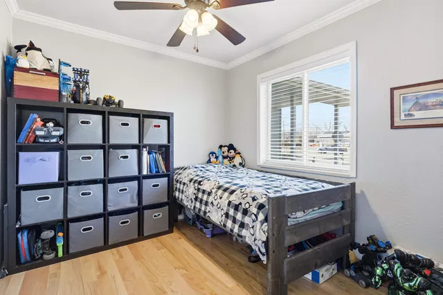 a bedroom with a bed and a book shelf