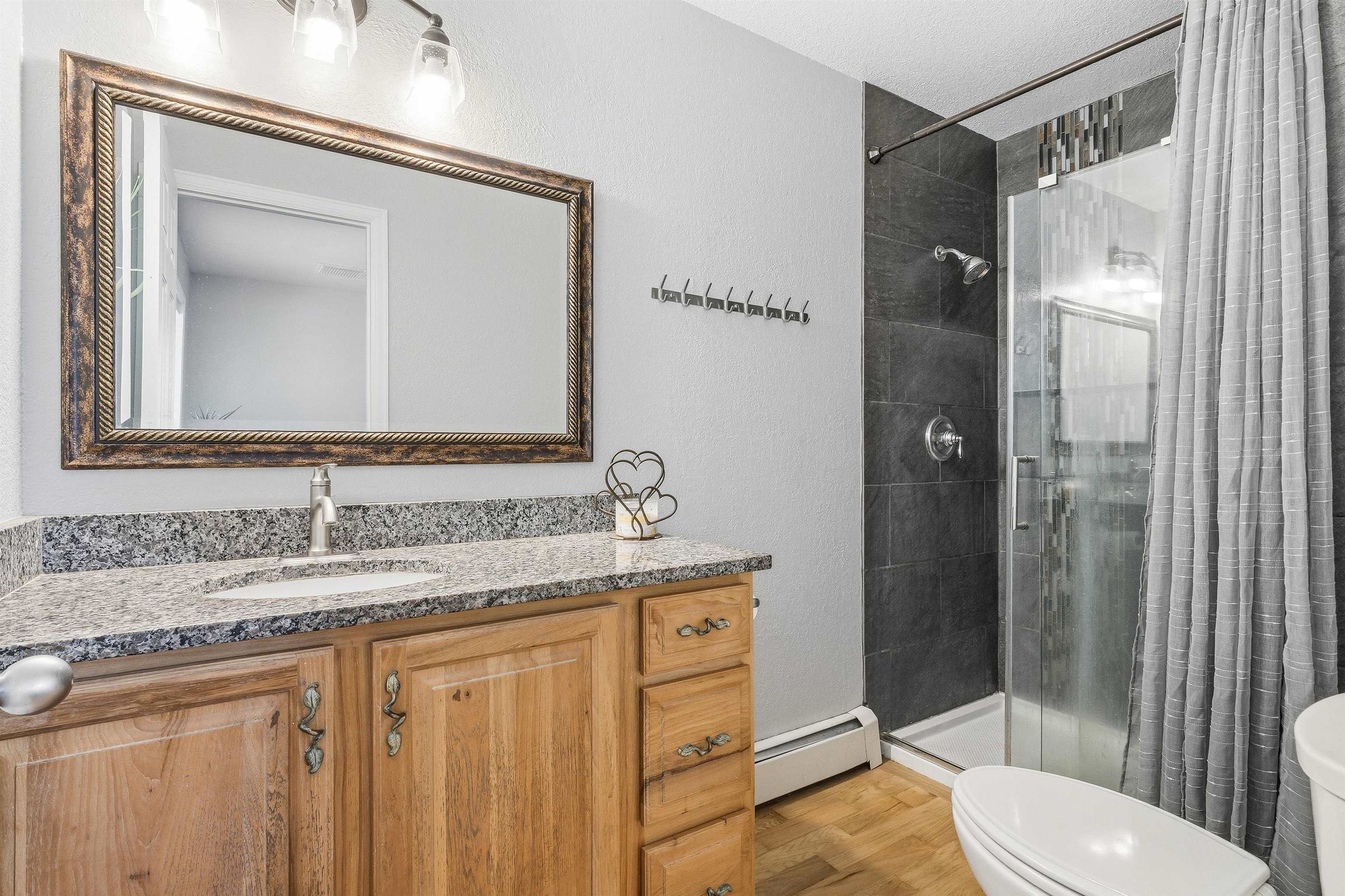 176-29 1/2 A 1/2 Road Grand Junction, CO 81503 - Photo 20 of 41 a bathroom with a granite countertop sink toilet and shower