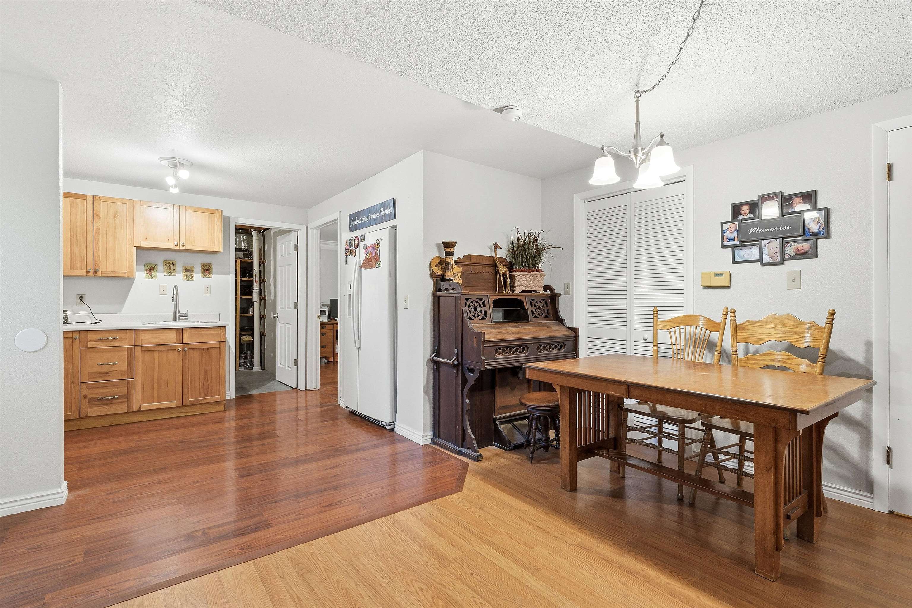 176-29 1/2 A 1/2 Road Grand Junction, CO 81503 - Photo 23 of 41 a room with stainless steel appliances kitchen island granite countertop a table chairs and a refrigerator