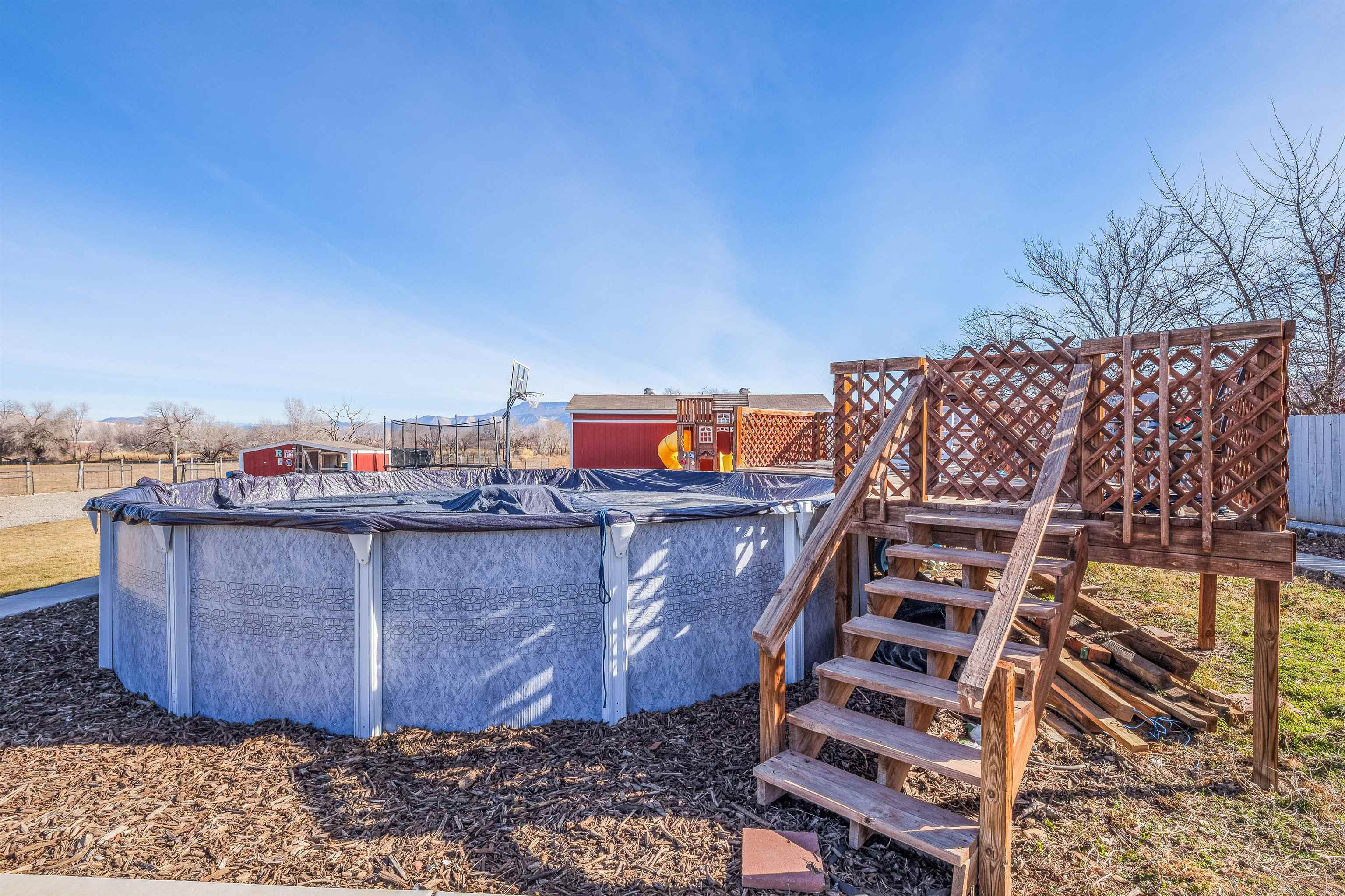 176-29 1/2 A 1/2 Road Grand Junction, CO 81503 - Photo 30 of 41 a view of a balcony with wooden floor and city view
