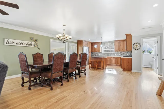 a view of a dining room with furniture and wooden floor