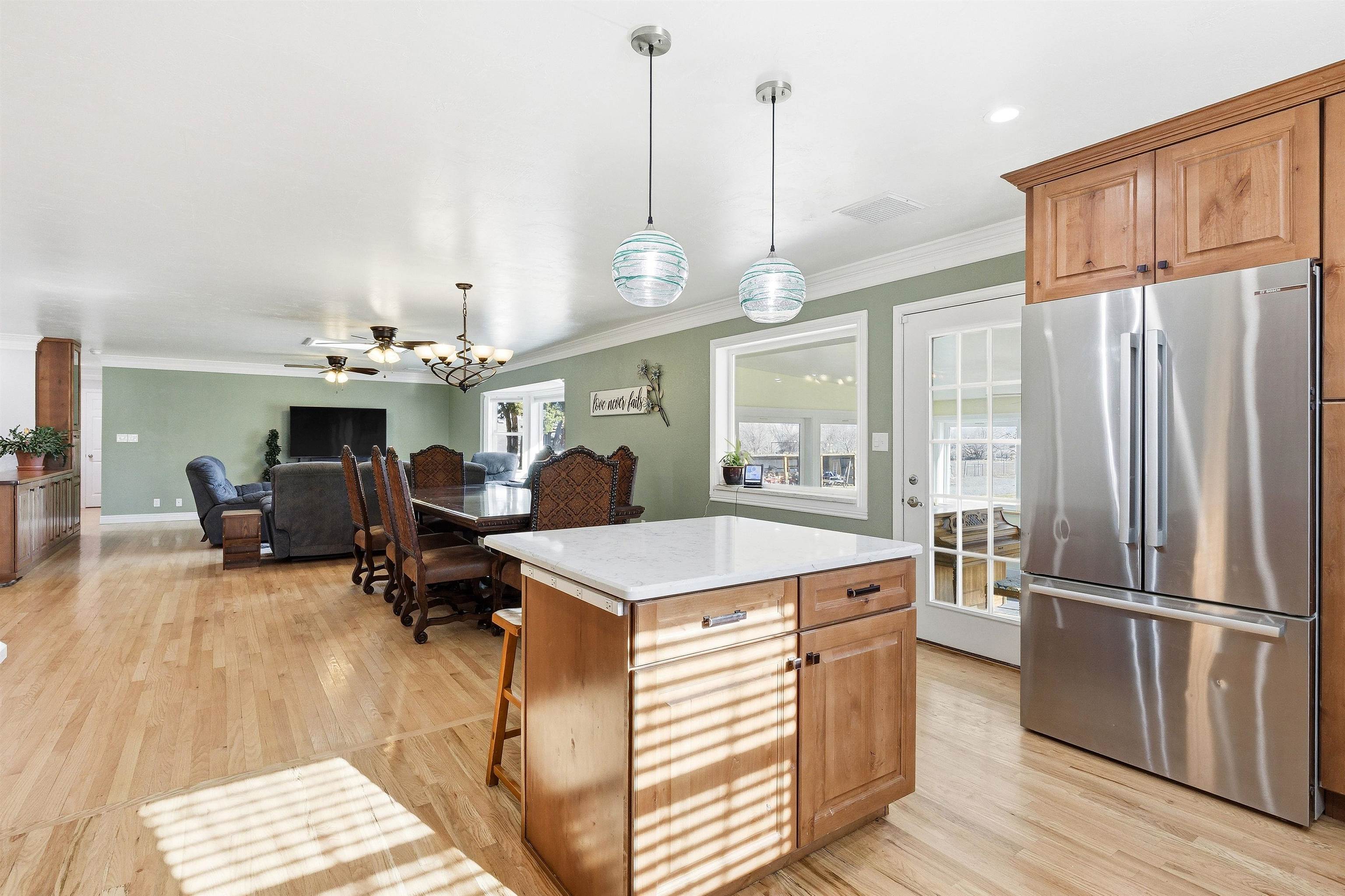 176-29 1/2 A 1/2 Road Grand Junction, CO 81503 - Photo 10 of 41 a large kitchen with a table chairs and a chandelier