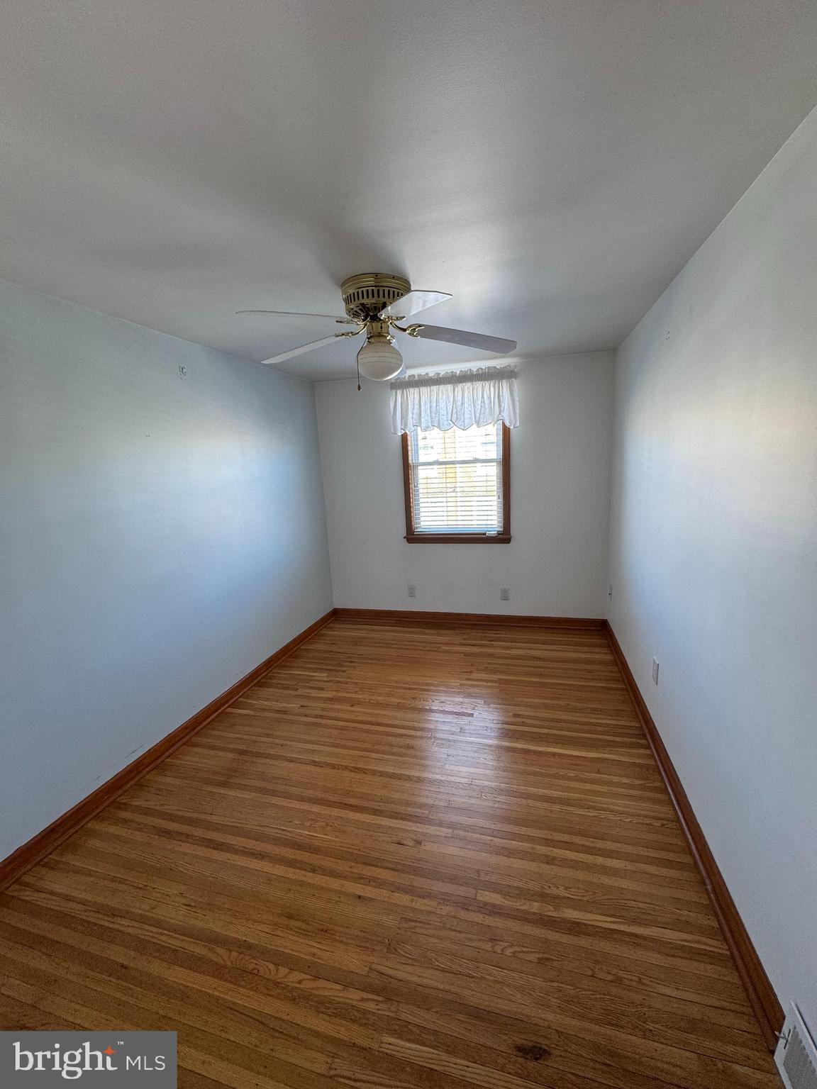 251 Revere Road Clifton Heights, PA 19018 - Photo 13 of 23 a view of empty room with wooden floor and fan