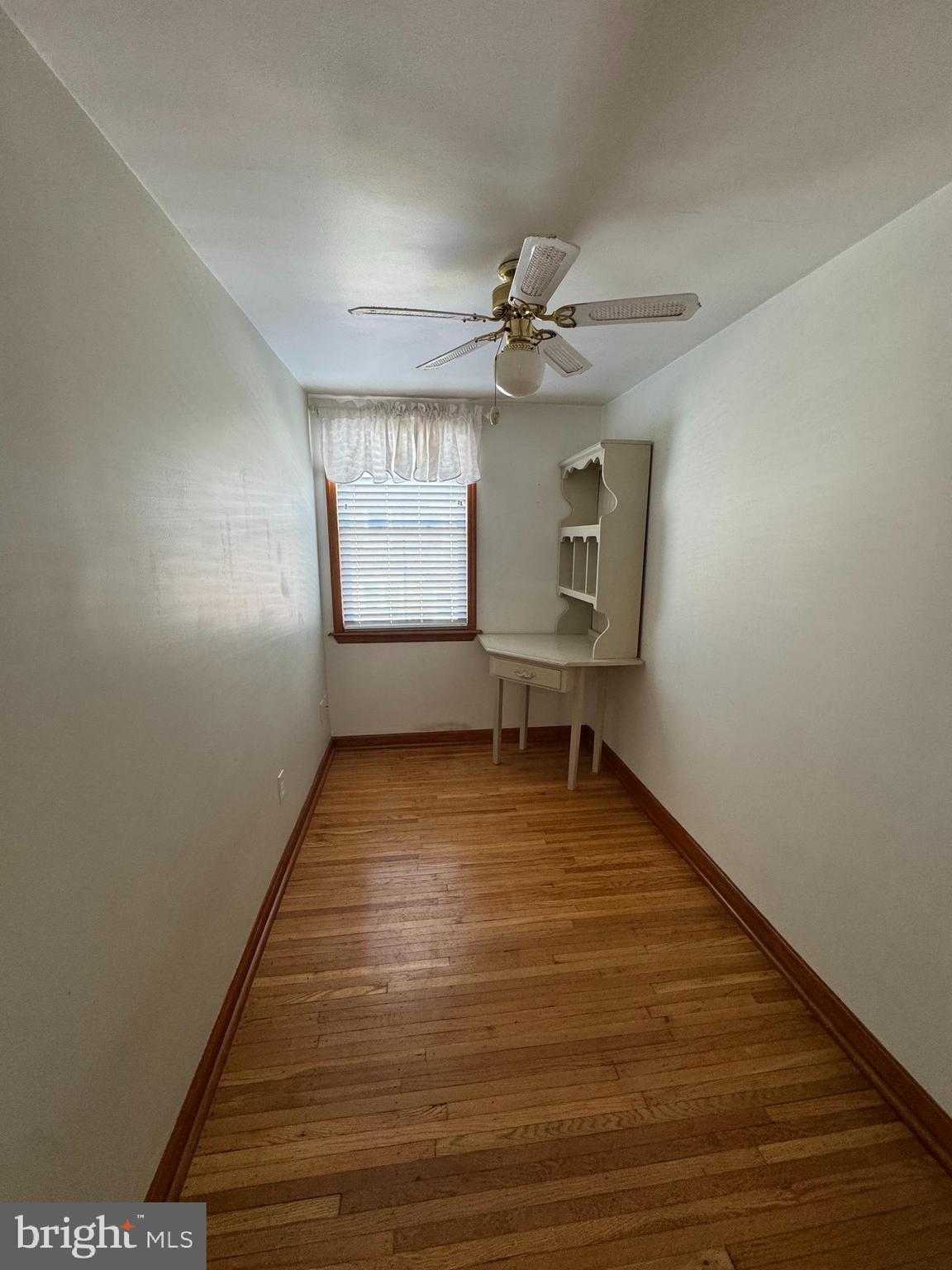 251 Revere Road Clifton Heights, PA 19018 - Photo 14 of 23 a view of empty room with wooden floor and fan